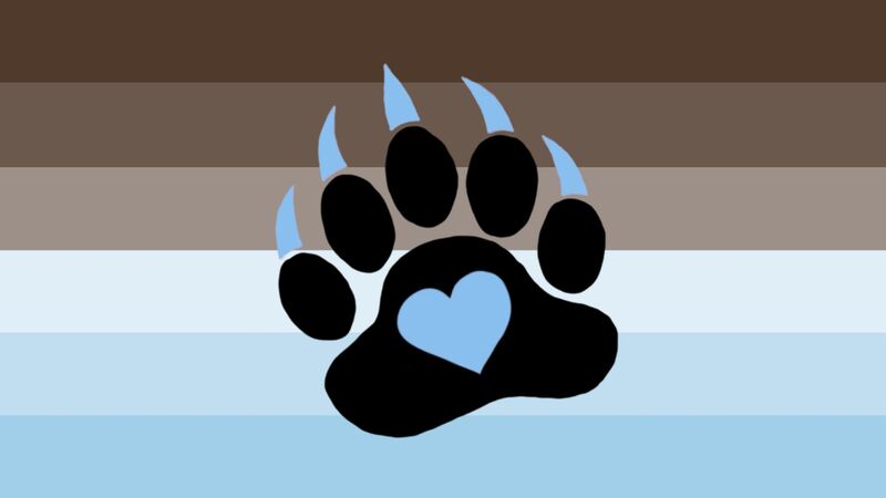 Flag with 6 horizontal stripes in the color order form top to bottom being brown, lighter brown, even lighter brown, light baby blue, darker baby blue, and even darker baby blue. There is a slightly tilted black bear paw print in the center of the flag with baby blue claws and a baby blue heart in the center of the main paw pad. 