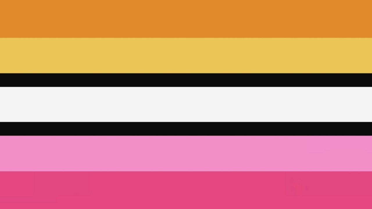 flag with 7 horizontal stripes, with the stripes all being similar in size but the stripes on either side of the middle white stripe being thin and black. the top stripes are dark gold and light gold. the last stripe is dark pink and above it is a light fuschia stripe.