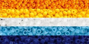 aroace flag with each stripe being replaced by a close up picture of a collection of seed beads with the corresponding stripe color. this is the orange, yellow, white, light blue, and dark blue flag.