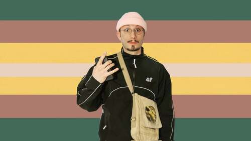 flag with 7 horizontal stripes in the color order of forest green, pinkish brown, yellow, thin beige stripe, yellow, pinkish brown, and forest green. There is a sticker of the rapper bbno$ on the flag. 