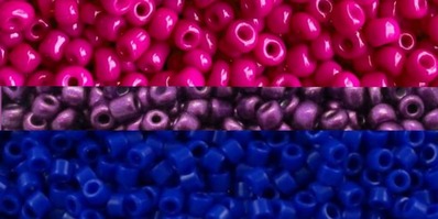 bi flag with each stripe being replaced by a close up picture of a collection of seed beads with the corresponding stripe color