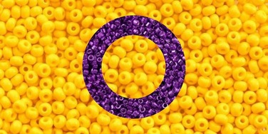 oii intersex flag edit where the background is an image of yellow beads and on the flag is a hollow circle made from a separate image of purple beads 