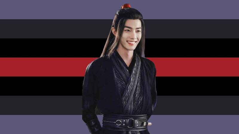 flag with 7 horizontal stripes. The middle stripe is deep red and on either side going outward are stripes that are black, dark grey, and a blue toned grey. Wei Wuxian is on the flag, an Asian person with long brown hair that has a high red ponytail and a small portion of long bangs hanging down on the sides. He is wearing black traditional Chinese clothing with his hands behind his back. He has a grin on his face.